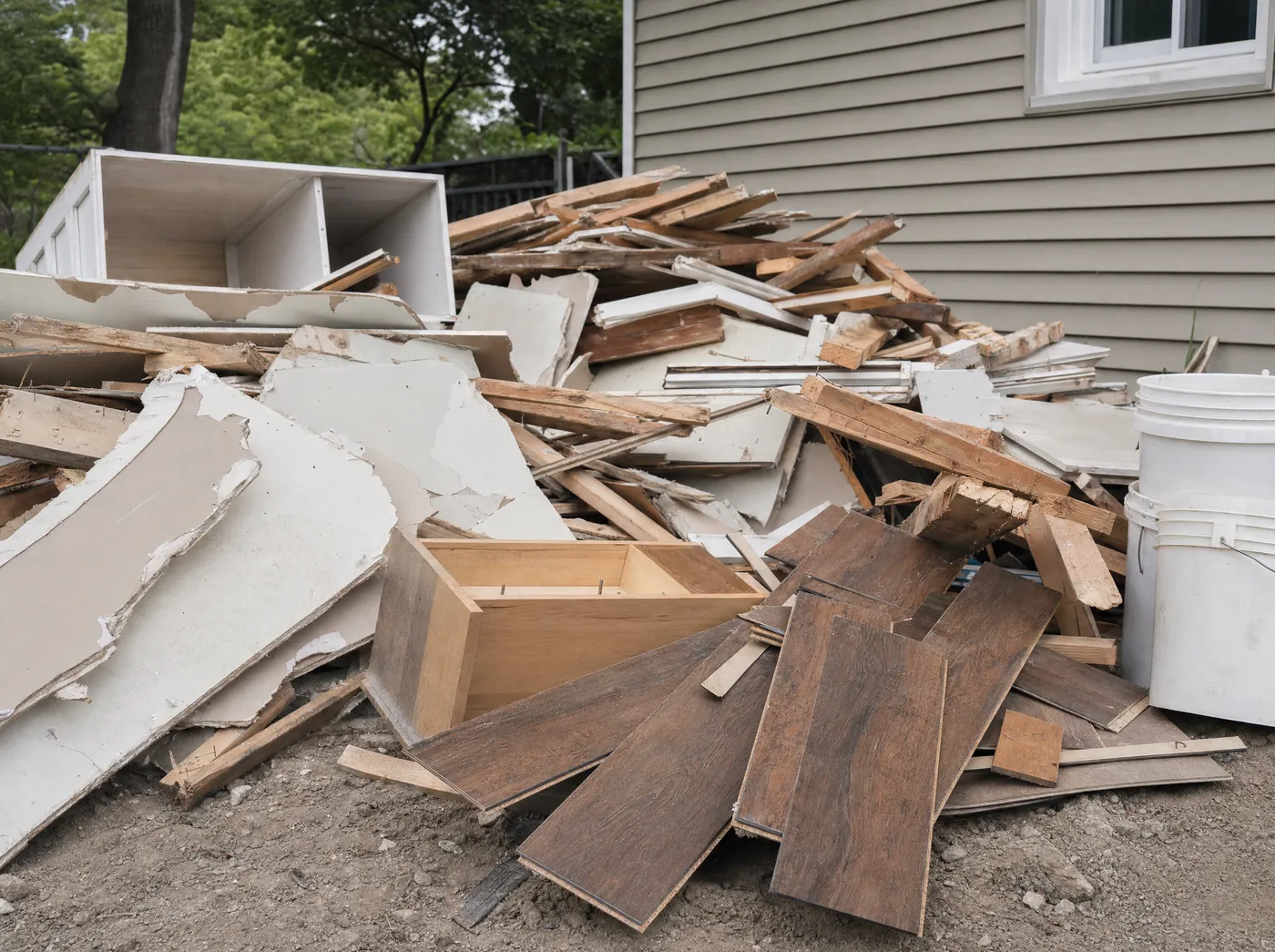 Drywall, scrap lumber and remodel tear-out debris at a job site