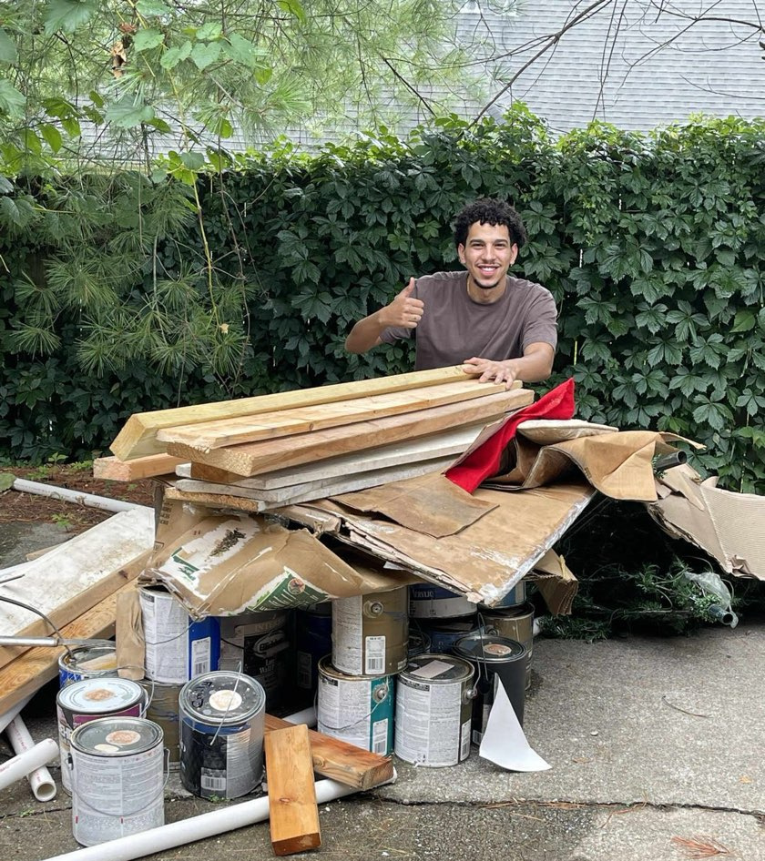 Amir, owner of Buddies Junk Removal, on a job site
